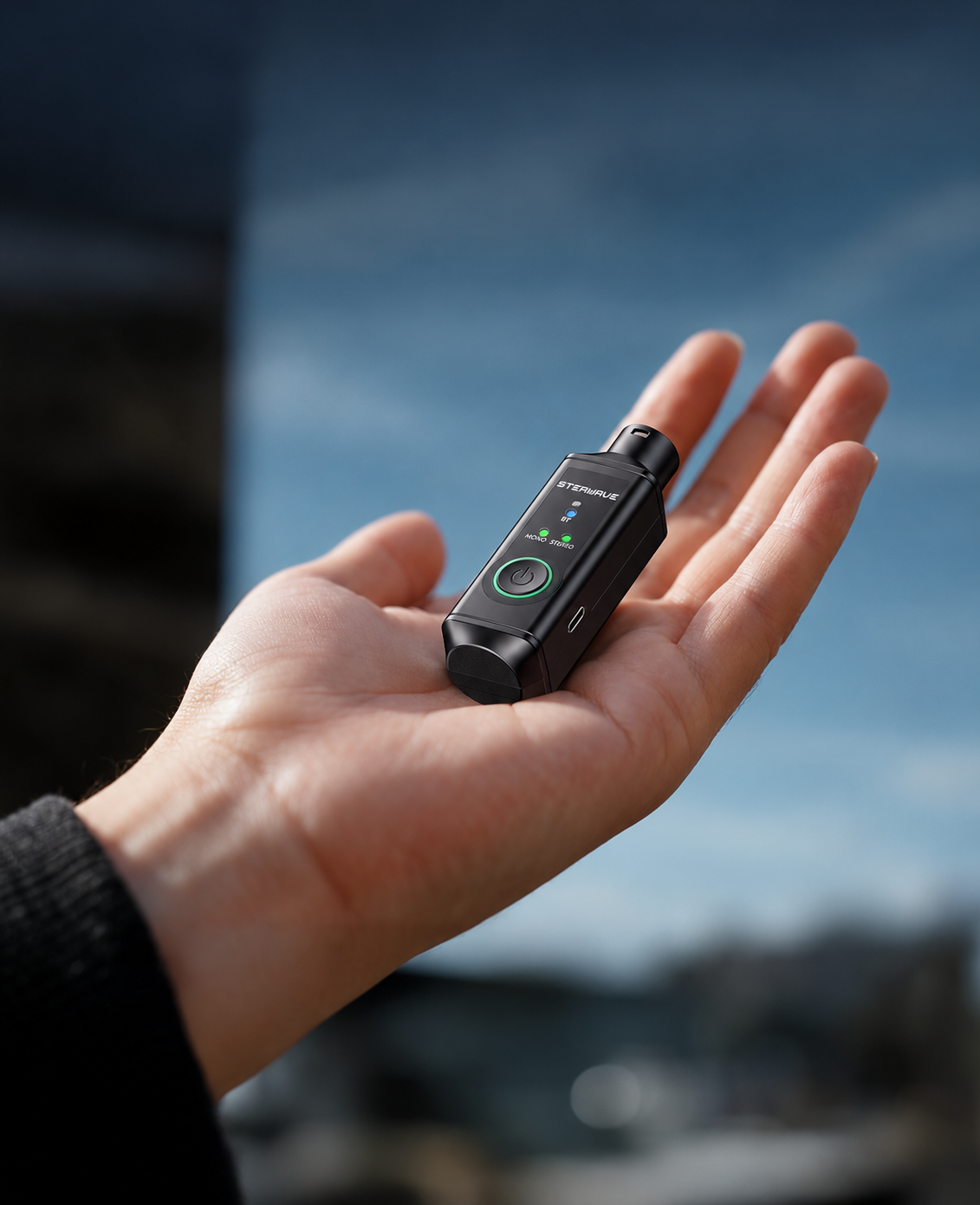 Compact receiver resting in an open palm, adapted from the supplied reference photograph